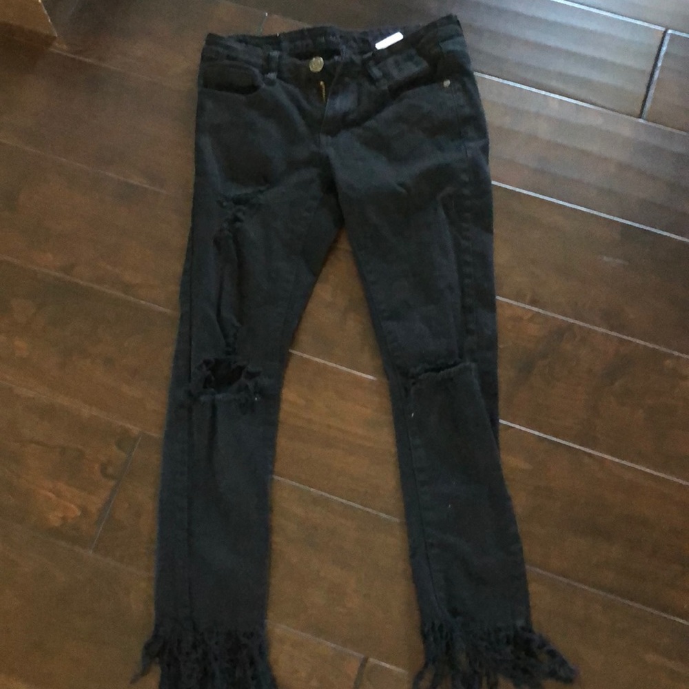 Black ripped jeans with fringe